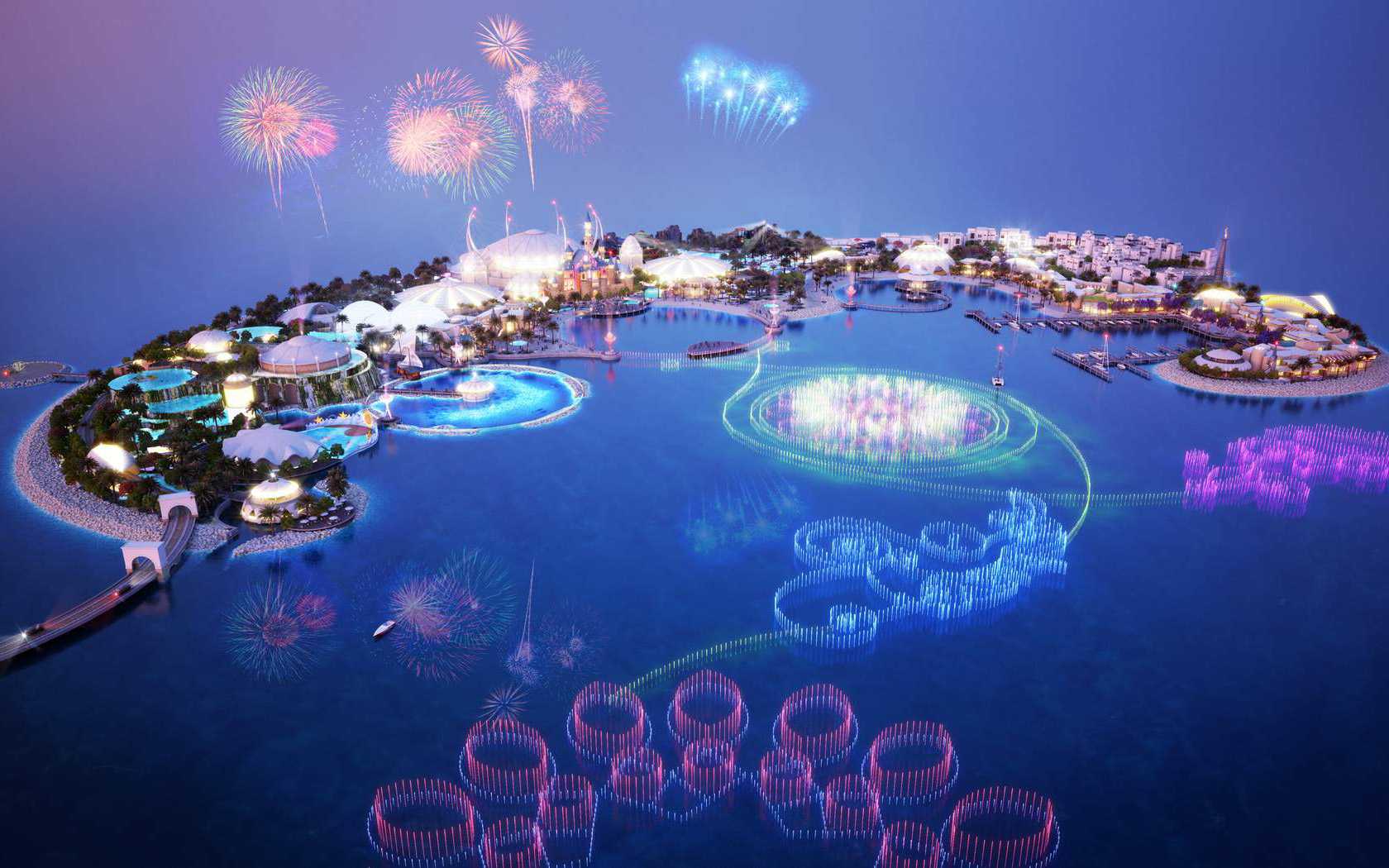 Aerial dusk render of island resort with fireworks and fountain display